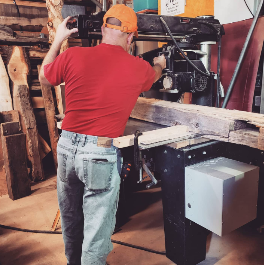 Jim working at one of the saws in his workshop