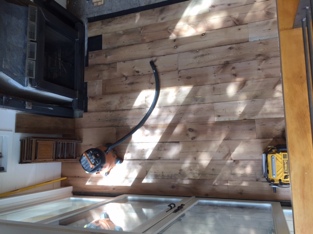 An overhead view of newly installed hardwood flooring in a client's vacation home.