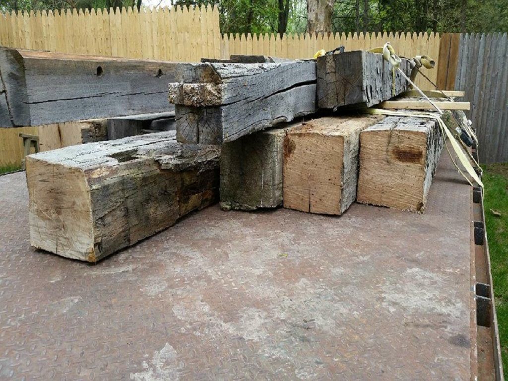 Custom sized barn beams loaded on a trailer for a local delivery